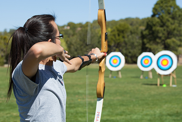 Hao Luo (SF20) prepares to shoot at a target during the archery team's recent competition against the Institute of American Indian Arts.