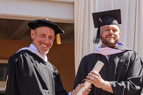 Alex Clark (EC24) and J. Walter Sterling at Santa Fe Commencement